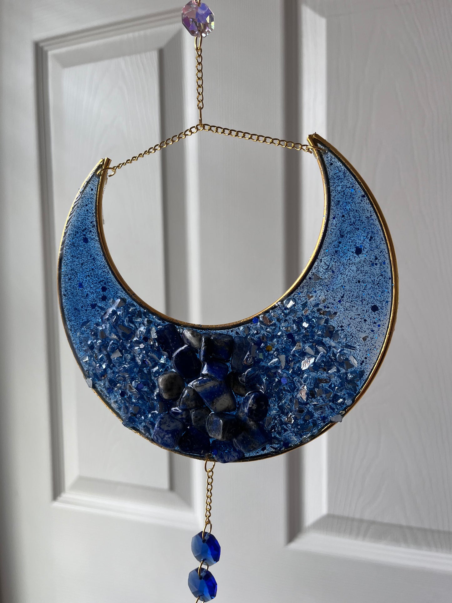 Sodalite crescent moon suncatcher with crystal accents