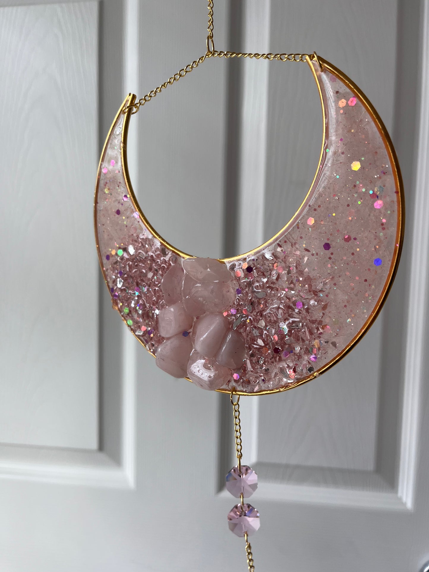 Rose quartz crescent moon suncatcher with crystal accents