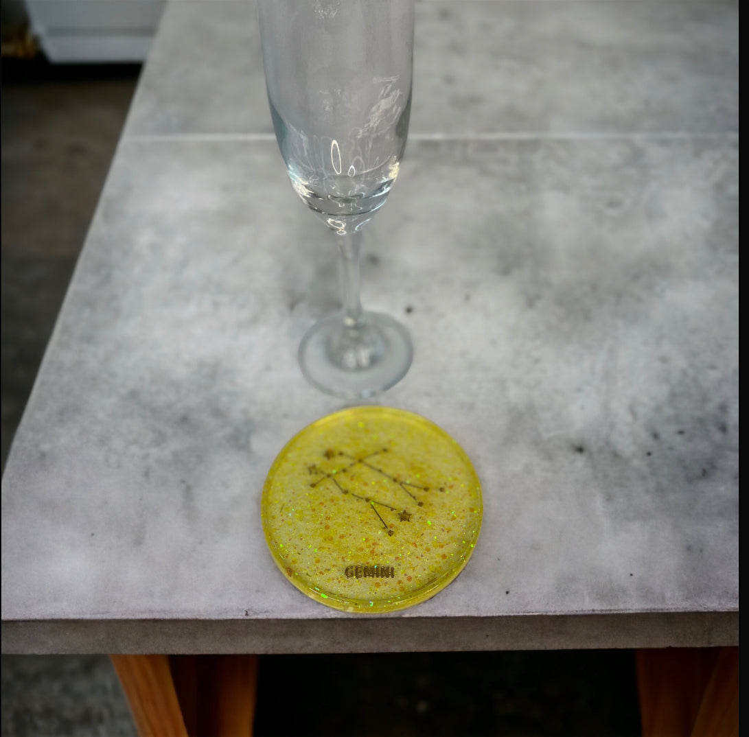 Gemini Zodiac Coaster on table with glass