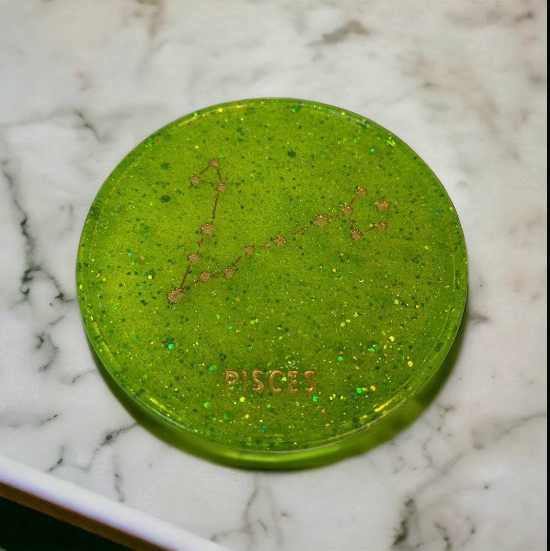Handmade Pisces zodiac coaster in vibrant green resin.