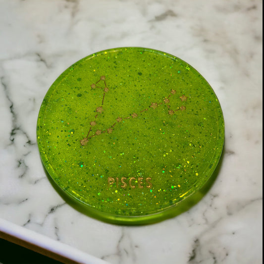 Handmade Pisces zodiac coaster in vibrant green resin.