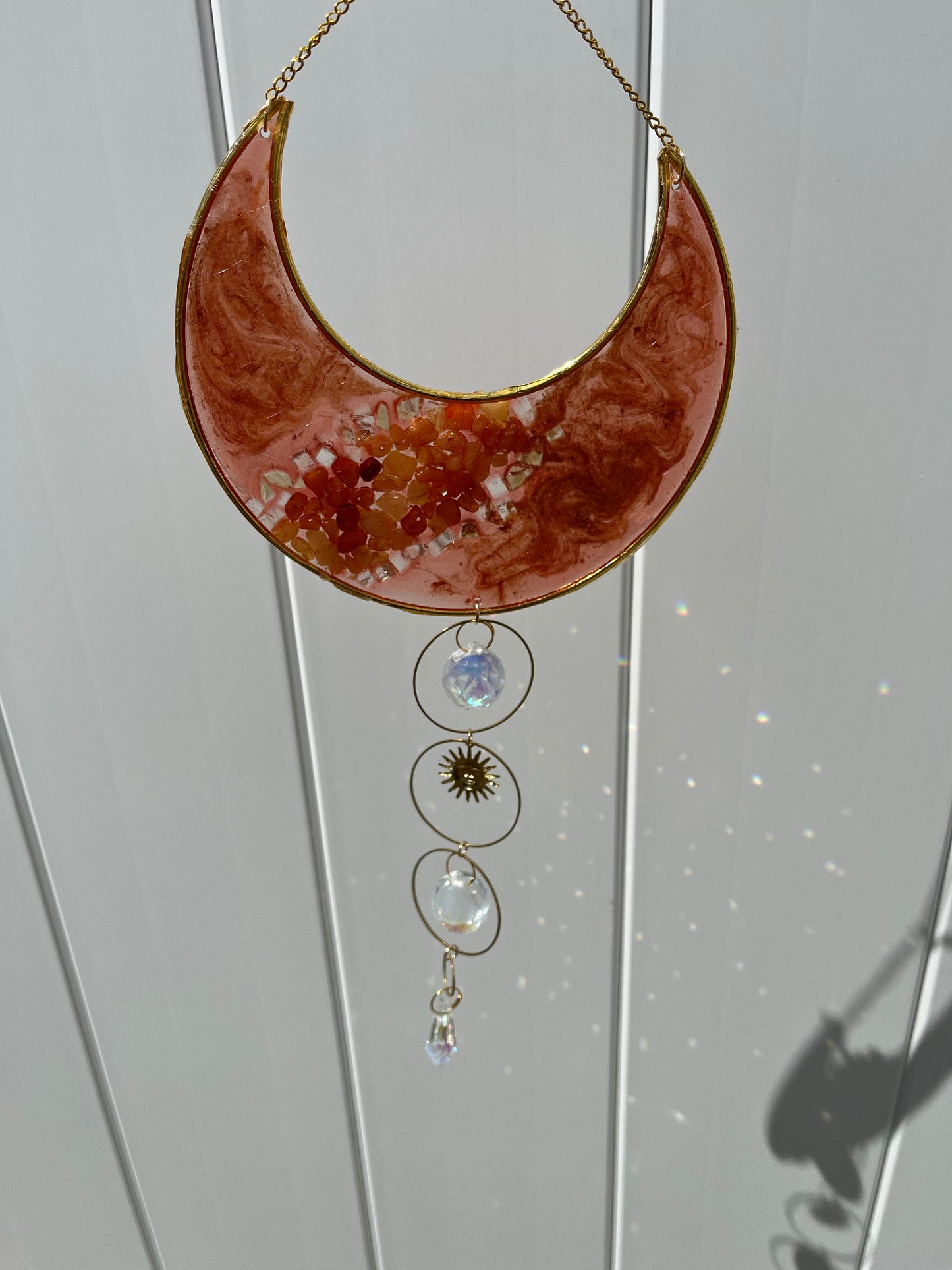 Carnelian crescent moon suncatcher with crystal accents