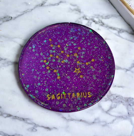 Purple Sagittarius zodiac coaster with starry design